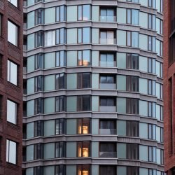 View of modern architectural buildings with glass and brick facades in Copenhagen, Denmark.